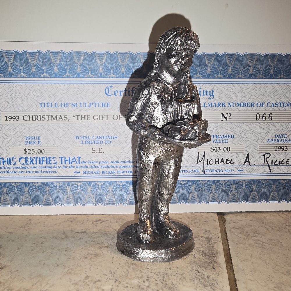 Silver Sculpture with Naturalistic Forms and Relaxed Posture